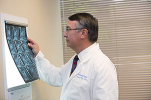 Dr. Wong looking at an x-ray